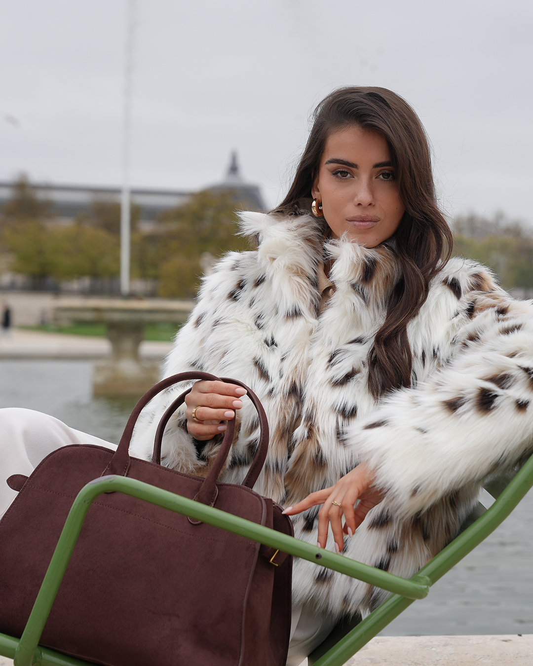SOERA brand campaign with a white outfit and burgundy bag.
